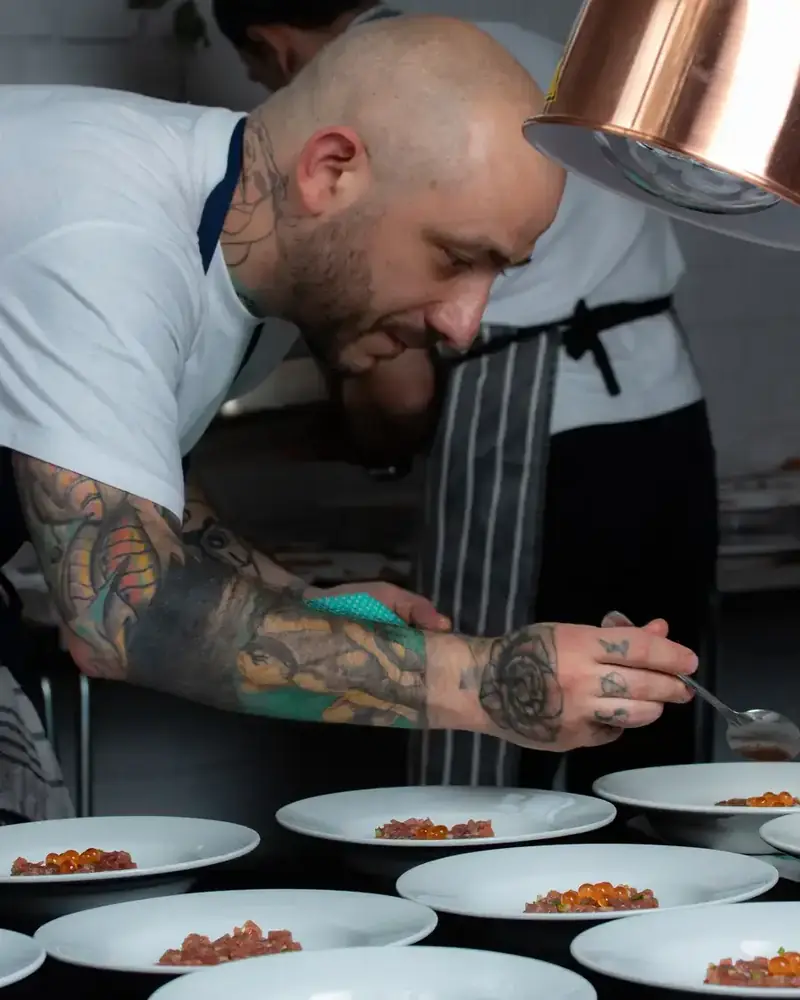 Domu chef plating dishes for service