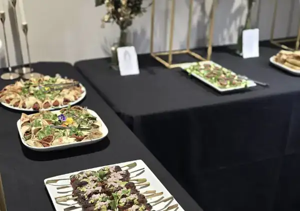 Canape reception on black linen at a corporate event