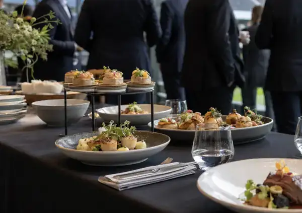 Canapes and small plates laid out at a drinks reception