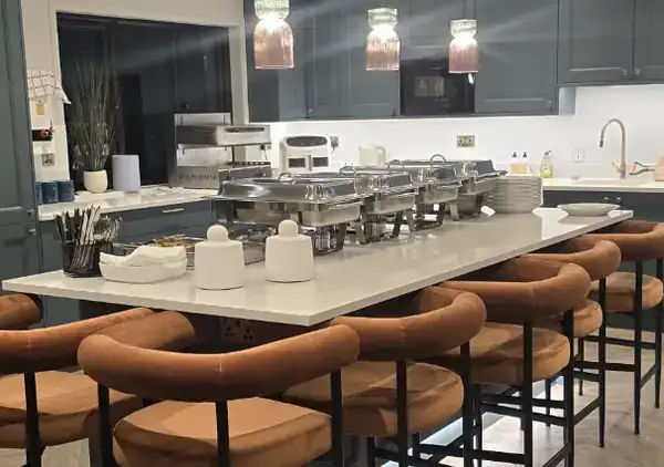 Chafing dishes set up for a private buffet at home