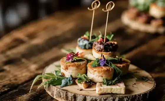 Artisan canapes on a rustic board